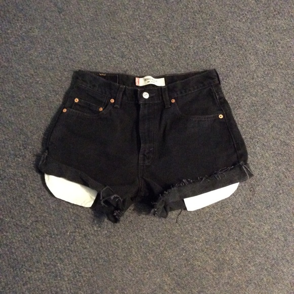 ripped jean shorts with pockets hanging out